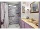 The bathroom features a marble-tiled shower and a stylish vanity at 12501 Ulmerton Rd # 89, Largo, FL 33774