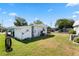Charming single-story home featuring a well-maintained lawn, siding, and a convenient carport for easy parking at 12501 Ulmerton Rd # 89, Largo, FL 33774