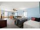 Cozy living room with comfortable seating, ceiling fan, and sliding glass doors to enjoy the view at 12501 Ulmerton Rd # 89, Largo, FL 33774