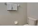 Neutral-painted bathroom featuring a toilet, decorative towel, and paper holder at 12952 Utopia Gardens Way, Riverview, FL 33579
