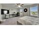Bedroom with large windows, desk, comfy chair, and closet for plenty of storage at 12952 Utopia Gardens Way, Riverview, FL 33579