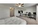 Bedroom featuring a TV, desk, chair and multiple windows for plenty of natural light at 12952 Utopia Gardens Way, Riverview, FL 33579