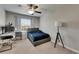 Comfortable bedroom with carpet, desk, computer, ceiling fan, and bright window at 12952 Utopia Gardens Way, Riverview, FL 33579