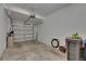 A well-lit two car garage with plenty of storage space at 12952 Utopia Gardens Way, Riverview, FL 33579