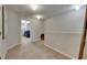 Second floor landing featuring plush neutral carpeting and views of the bedrooms at 12952 Utopia Gardens Way, Riverview, FL 33579