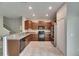 Kitchen featuring stainless appliances, granite countertops, cabinets, and tile floors at 12952 Utopia Gardens Way, Riverview, FL 33579