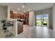 An open concept kitchen featuring an island with seating and stainless steel appliances at 12952 Utopia Gardens Way, Riverview, FL 33579