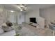 Spacious living area with stairs, ceiling fan, gray walls, and tile flooring throughout at 12952 Utopia Gardens Way, Riverview, FL 33579