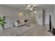 Living room with tile flooring, neutral paint colors, modern furnishings, and lots of natural light at 12952 Utopia Gardens Way, Riverview, FL 33579