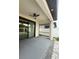 Covered back patio with ceiling fan and sliding glass doors for indoor/outdoor living at 13172 Green Violet Dr, Riverview, FL 33579