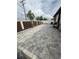 Large backyard with paver patio and white and brown fencing at 13172 Green Violet Dr, Riverview, FL 33579