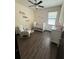 Charming Bedroom featuring natural light, wood-style floors and a cozy rocking chair at 13172 Green Violet Dr, Riverview, FL 33579