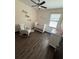 Bright Bedroom features wood-style floors, natural light and comfortable rocking chair at 13172 Green Violet Dr, Riverview, FL 33579