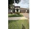 Well-maintained single-Gathering home with lush green lawn and mature landscaping at 13172 Green Violet Dr, Riverview, FL 33579