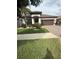 Well-maintained single-Gathering home with lush green lawn and mature landscaping at 13172 Green Violet Dr, Riverview, FL 33579