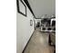 Hallway leading to the kitchen featuring an eat-in island with pendant lighting at 13172 Green Violet Dr, Riverview, FL 33579
