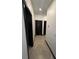 Hallway with tile flooring and black trim at 13172 Green Violet Dr, Riverview, FL 33579