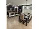 Open-concept kitchen with large island, dark cabinets, and adjoining dining area at 13172 Green Violet Dr, Riverview, FL 33579
