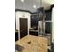 Stylish kitchen with stainless steel fridge, granite counters, and dark cabinets at 13172 Green Violet Dr, Riverview, FL 33579