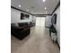 Open living room featuring tile floors, recessed lighting, dark trim, and sliding glass doors to the exterior at 13172 Green Violet Dr, Riverview, FL 33579