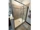 Shower enclosure featuring tiled walls and a glass door at 13172 Green Violet Dr, Riverview, FL 33579
