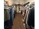 Spacious walk-in closet with custom shelves and clothing racks at 13172 Green Violet Dr, Riverview, FL 33579