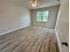 Spacious bedroom with a ceiling fan and window at 13532 14Th St, Dade City, FL 33525