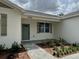 Charming front entrance with brick facade, new paint, and manicured landscaping at 13532 14Th St, Dade City, FL 33525