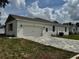 Charming single-story home featuring a two car garage and light colored brick paver driveway at 13532 14Th St, Dade City, FL 33525