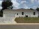 Charming single-story home featuring a two car garage and light colored brick paver driveway at 13532 14Th St, Dade City, FL 33525