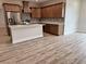 An open concept kitchen with stainless steel appliances, light countertops, and backsplash at 13532 14Th St, Dade City, FL 33525