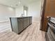 Kitchen island features a sink and stainless steel dishwasher at 13532 14Th St, Dade City, FL 33525