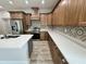 Modern kitchen featuring stainless steel appliances, wood cabinets and hardwood floors at 13532 14Th St, Dade City, FL 33525