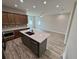 Stylish kitchen featuring a modern island, stainless steel appliances, and designer backsplash at 13532 14Th St, Dade City, FL 33525