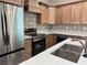 Modern kitchen featuring stainless steel appliances and a large sink at 13532 14Th St, Dade City, FL 33525