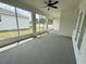 Screened-in lanai with ceiling fan at 13532 14Th St, Dade City, FL 33525