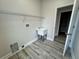 Utility sink and wire shelving in the laundry room at 13532 14Th St, Dade City, FL 33525
