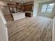 Spacious living room area shows wood floors, lots of light, and neutral paint at 13532 14Th St, Dade City, FL 33525