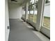 This is a view of the screened-in patio with bright, natural light and a view of the backyard at 13532 14Th St, Dade City, FL 33525