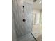 Close up of modern shower with unique tiling and fixtures at 13532 14Th St, Dade City, FL 33525