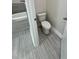 Clean and well-maintained toilet in a separate commode at 13532 14Th St, Dade City, FL 33525