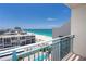 The spacious balcony overlooks the ocean and features a metal railing at 1390 Gulf Blvd # Ph-5, Clearwater, FL 33767