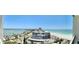 Wide balcony view of a coastal city, beach, and the ocean at 1390 Gulf Blvd # Ph-5, Clearwater, FL 33767