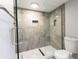 Bathroom with glass-enclosed shower and modern fixtures at 1390 Gulf Blvd # Ph-5, Clearwater, FL 33767
