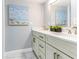 Bright bathroom with double vanity and artwork at 1390 Gulf Blvd # Ph-5, Clearwater, FL 33767
