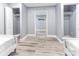 Spacious bedroom with neutral walls, wood floors, and two closets with shelving for ample storage at 1390 Gulf Blvd # Ph-5, Clearwater, FL 33767