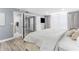 Bright main bedroom with walk-in closet, gray drapes, and attached bathroom at 1390 Gulf Blvd # Ph-5, Clearwater, FL 33767