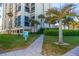 Beautiful exterior view of the condo complex, showcasing well-maintained grounds and landscaping at 1390 Gulf Blvd # Ph-5, Clearwater, FL 33767
