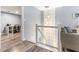 Hallway landing with glass railings and view of an office nook at 1390 Gulf Blvd # Ph-5, Clearwater, FL 33767