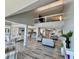 Spacious living room features modern decor, an open floor plan, and a view of the second-story loft at 1390 Gulf Blvd # Ph-5, Clearwater, FL 33767